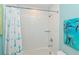 Inviting bathroom with white subway tiles and a combined shower and tub at 205 Elm Ave, Anna Maria, FL 34216