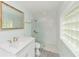 Bright bathroom with glass shower and a stylish vanity, offering a clean and modern coastal look at 205 Elm Ave, Anna Maria, FL 34216