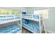 Charming bunk bedroom with two sets of bunk beds and beach-themed decor at 205 Elm Ave, Anna Maria, FL 34216