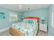 Bedroom with beach themed decor and wicker bed frame, creating a cozy atmosphere at 205 Elm Ave, Anna Maria, FL 34216