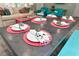 Close up of the dining table set with colorful placemats and center succulent decorations at 205 Elm Ave, Anna Maria, FL 34216