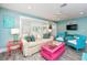 Bright living room offers coastal decor, plenty of seating and natural light at 205 Elm Ave, Anna Maria, FL 34216