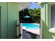A refreshing pool area with an umbrella, offering a serene outdoor retreat at 205 Elm Ave, Anna Maria, FL 34216