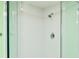 This renovated shower is enclosed in glass with white subway tile and modern fixtures, adding an elegant touch at 205 Elm Ave, Anna Maria, FL 34216