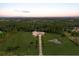 Expansive estate featuring a long driveway, a pond, and lush landscaping surrounded by forest at 20706 79Th E Ave, Bradenton, FL 34202