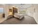 Inviting bedroom with a plush bed, decorative tapestry, and serene lighting at 20706 79Th E Ave, Bradenton, FL 34202