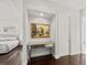 Hallway with console table and artwork with doorway leading to bedroom at 20706 79Th E Ave, Bradenton, FL 34202