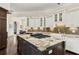 Gourmet kitchen featuring large island, white cabinets, and stainless steel appliances at 20706 79Th E Ave, Bradenton, FL 34202