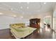 Spacious living room with detailed paneling, dark wood floors, and ample seating at 20706 79Th E Ave, Bradenton, FL 34202