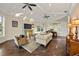 Bright living room boasts hardwood floors, coffered ceilings, and neutral paint at 20706 79Th E Ave, Bradenton, FL 34202