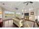 Bright living room with vaulted ceilings, multiple windows, and comfortable seating at 20706 79Th E Ave, Bradenton, FL 34202