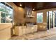 Outdoor kitchen features built-in BBQ grill and sink, granite counters, and white cabinets at 20706 79Th E Ave, Bradenton, FL 34202