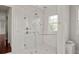 Modern bathroom shower with sleek fixtures and floor-to-ceiling marble at 20706 79Th E Ave, Bradenton, FL 34202
