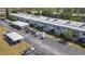 Aerial view of condo complex featuring multiple units and covered parking at 21300 Brinson Ave # 214, Port Charlotte, FL 33952