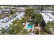 Aerial view of building showing swimming pool and surrounding greenery at 21300 Brinson Ave # 214, Port Charlotte, FL 33952