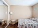 A bedroom with wood floors, neutral walls and closet with mirror doors at 21300 Brinson Ave # 214, Port Charlotte, FL 33952