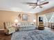 Comfortable living room featuring hardwood floors, a ceiling fan, and a neutral color palette at 21300 Brinson Ave # 214, Port Charlotte, FL 33952