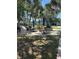 Outdoor grill area with tables and chairs, perfect for entertaining guests or enjoying a barbecue at 21300 Brinson Ave # 214, Port Charlotte, FL 33952