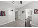 Hallway showcasing an office chair, a closet, and access to the bathroom at 224 Caserta Ct, Nokomis, FL 34275