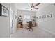Charming home office with neutral tones, a ceiling fan, and a view of the outdoors at 224 Caserta Ct, Nokomis, FL 34275