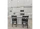 Beautiful kitchen with white cabinetry, stainless steel appliances, and pendant lighting above the center island at 224 Caserta Ct, Nokomis, FL 34275