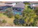 Aerial view of screened-in pool with mature landscaping, perfect for outdoor relaxation at 224 Caserta Ct, Nokomis, FL 34275