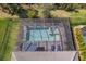 Screened pool and spa surrounded by brick pavers, a perfect place for outdoor lounging at 224 Caserta Ct, Nokomis, FL 34275