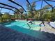 Stunning screened pool and spa surrounded by brick pavers, ideal for relaxation at 224 Caserta Ct, Nokomis, FL 34275