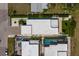 Great aerial view of the modern home and swimming pool with tropical landscaping at 2365 Novus St, Sarasota, FL 34237