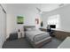 Modern bedroom with a ceiling fan, clean lines, sleek furniture, and bright natural light at 2365 Novus St, Sarasota, FL 34237