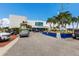 Modern building with palm trees, featuring valet parking, enhancing its appeal and accessibility at 2365 Novus St, Sarasota, FL 34237