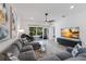 Spacious living room featuring recessed lighting, large windows and comfortable seating at 2365 Novus St, Sarasota, FL 34237