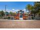 Vibrant community playground featuring a colorful circus theme, complete with slides and climbing structures at 2365 Novus St, Sarasota, FL 34237