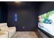 Home theater with navy walls, a large screen, and reclining leather chairs perfect for movie nights at 2365 Novus St, Sarasota, FL 34237