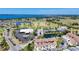 Expansive aerial view of the community showcasing the golf course, lakes, and proximity to the bay at 2609 Waterford Way # B, Palmetto, FL 34221