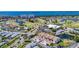 Stunning aerial shot of the community featuring well-maintained townhomes, a golf course, and picturesque water views at 2609 Waterford Way # B, Palmetto, FL 34221