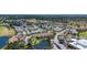 A sprawling aerial view of a meticulously planned community with lush greenery, scenic waterways, and diverse housing options at 2609 Waterford Way # B, Palmetto, FL 34221