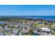 Sweeping aerial view of a coastal community featuring single-Gathering homes, condominiums, a golf course, and waterfront access at 2609 Waterford Way # B, Palmetto, FL 34221