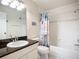 A bright bathroom with vanity and a tub with shower at 2609 Waterford Way # B, Palmetto, FL 34221