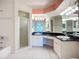 Bright bathroom features dual sinks, black granite countertops, shower and tub at 2609 Waterford Way # B, Palmetto, FL 34221