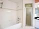 Bright bathroom features shower and tub with tile surround at 2609 Waterford Way # B, Palmetto, FL 34221