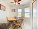 Dining area featuring a ceiling fan, and large windows providing plenty of natural light at 2609 Waterford Way # B, Palmetto, FL 34221