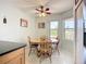 Dining area featuring a ceiling fan, and large windows providing plenty of natural light at 2609 Waterford Way # B, Palmetto, FL 34221