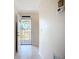 Bright entryway featuring a security door, light tile flooring, and neutral colored walls at 2609 Waterford Way # B, Palmetto, FL 34221