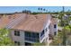 Townhouse showcasing a screen enclosed lanai and lush landscaping, providing a serene outdoor space at 2609 Waterford Way # B, Palmetto, FL 34221