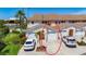 Close up view of the townhome, showing the roof, attached garage, and yard at 2609 Waterford Way # B, Palmetto, FL 34221