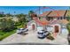 Exterior view of the townhome, showing the roof, attached garage, yard, and surrounding area at 2609 Waterford Way # B, Palmetto, FL 34221
