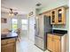 Eat-in kitchen area with stainless refrigerator and bright natural light at 2609 Waterford Way # B, Palmetto, FL 34221
