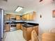 Updated kitchen features stainless steel appliances, tile flooring and dark countertops at 2609 Waterford Way # B, Palmetto, FL 34221