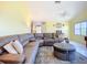Open living area featuring neutral colors, cozy seating, tile floors, and a ceiling fan at 2609 Waterford Way # B, Palmetto, FL 34221